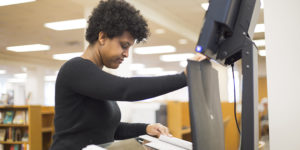 Student using library scanner