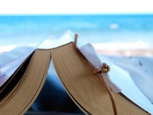 Reading a book at the beach by Simon on Flickr