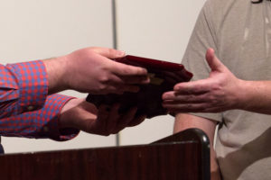 Plaque being presented to recipient