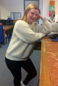 Maggie at the check out desk