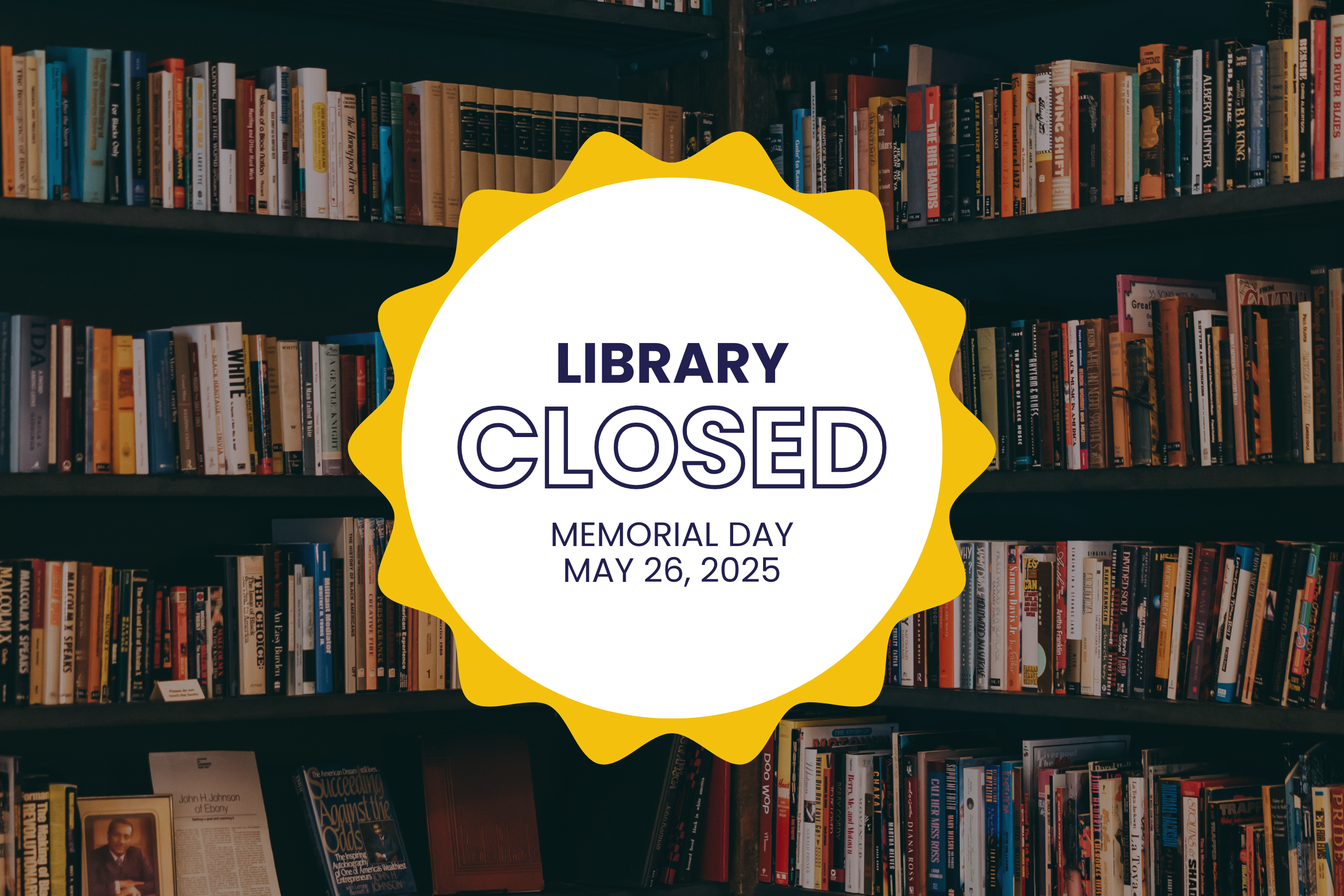 A circular white sign with a yellow sunburst border appears in front of a dark bookshelf filled with colorful books. The sign reads in bold navy text: "Library Closed. Memorial Day, May 26, 2025."